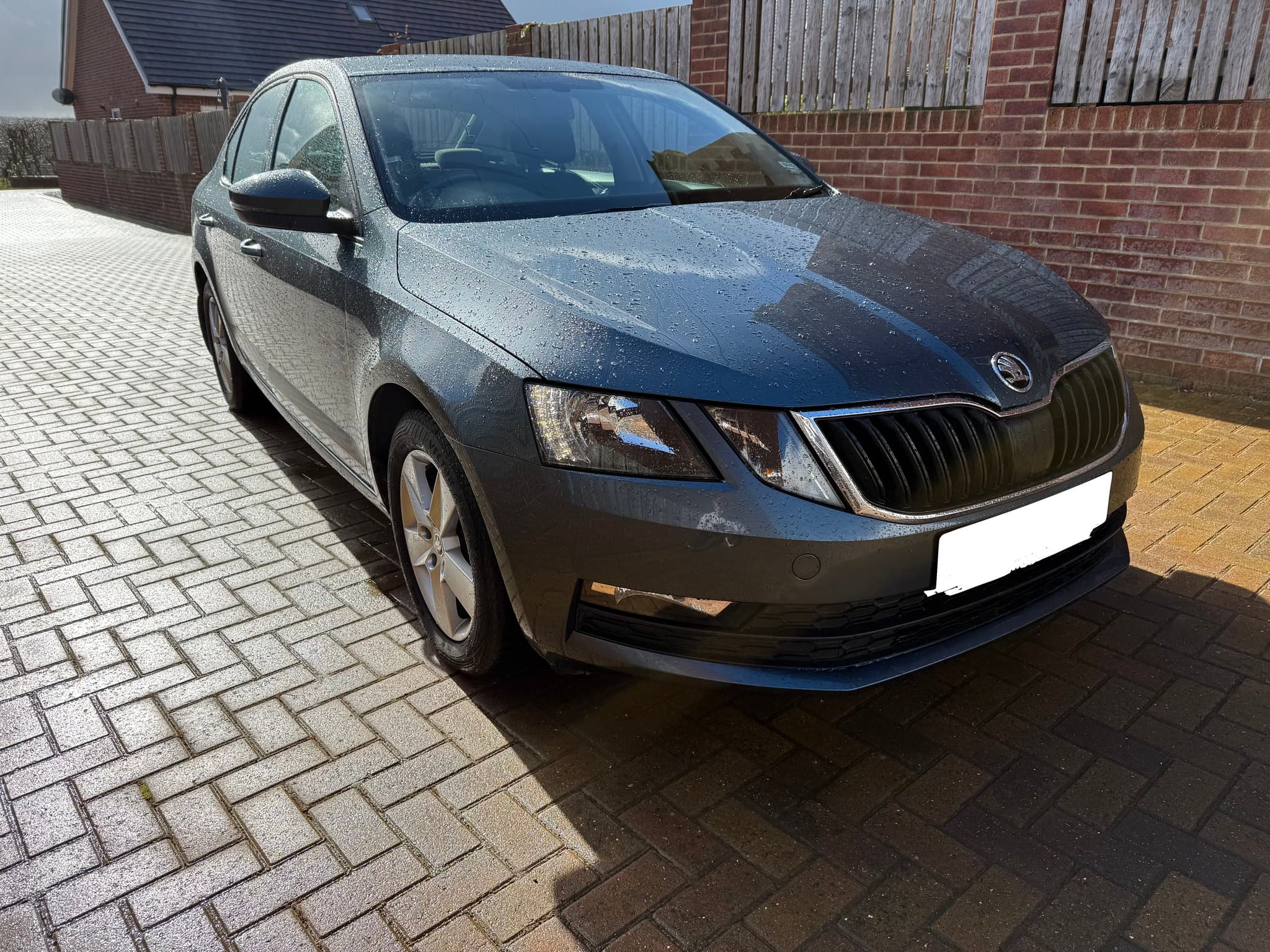 Grey Skoda private hire vehicle from the Red Kite Rentals fleet